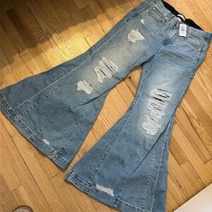 BNWT Torrid size 10/R Festi distressed sky high super flare jeans.